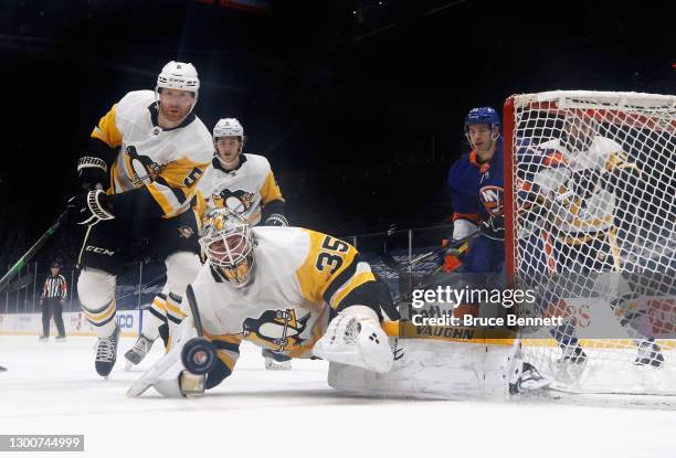 Tristan Jarry of the Pittsburgh Penguins makes the second period save against the New York Islanders at the Nassau Coliseum on February 06, 2021 in...