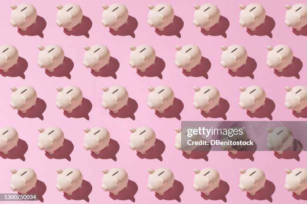 little pink ceramic piggy bank pattern on pink background. concept of saving money, savings. - money box stock pictures, royalty-free photos & images