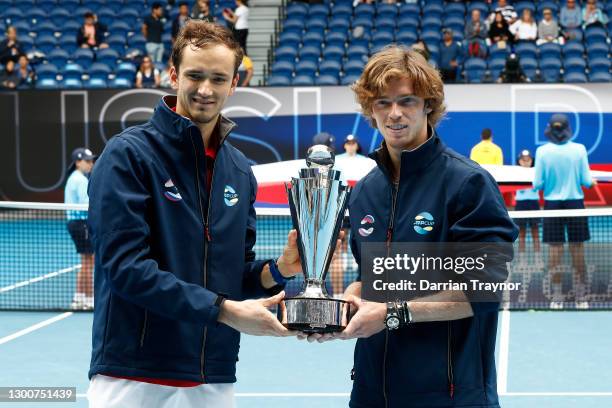 Daniil Medvedev of Russia and Andrey Rublev of Russia pose with the ATP Cup Trophy after defeating Italy in the Final during day six of the 2021 ATP...