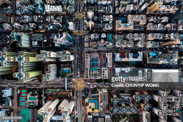 drone view of kowloon city in hong kong - tights stock pictures, royalty-free photos & images
