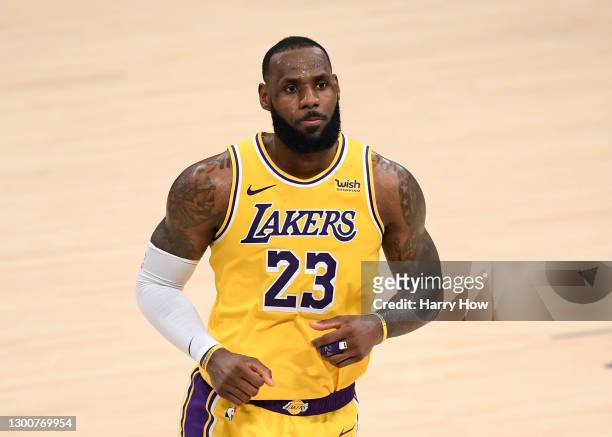 LeBron James of the Los Angeles Lakers reacts after his three pointer in double overtime to lead the Lakers to a 135-129 win over the Detroit...