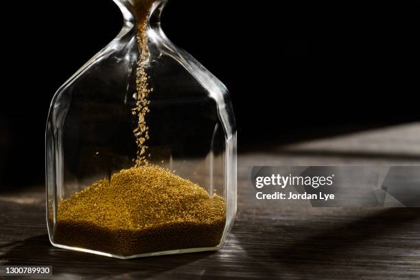 hourglass with golden sand - 砂時計　無人 ストックフォトと画像
