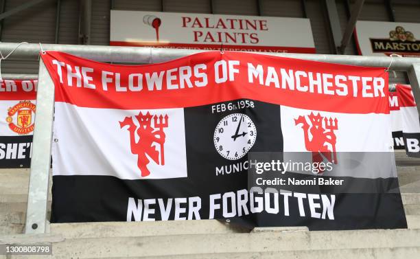 Flag is seen in the empty stands to mark the anniversary of the Munich Air Disaster ahead of the Barclays FA Women's Super League match between...