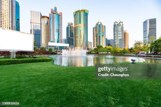 blank billboard in the public park in lujiazui financial district, pudong, shanghai, china - lakeshore park stock pictures, royalty-free photos & images