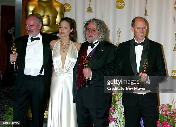 Alan Lee, Dan Hennah and Grant Major, winners of Achievement in Art Direction for "The Lord of The Rings: The Return of the Kings", with presenter...