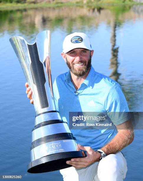 Dustin Johnson of the USA with the winners trophy after the final round of the Saudi International powered by SoftBank Investment Advisers at Royal...