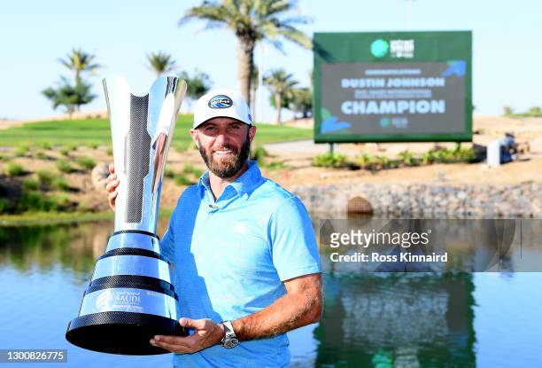 Dustin Johnson of the USA with the winners trophy after the final round of the Saudi International powered by SoftBank Investment Advisers at Royal...