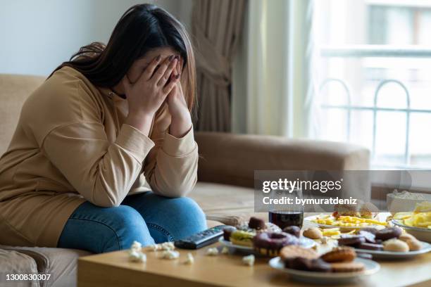 unhappy stressed woman - eating alone stock pictures, royalty-free photos & images