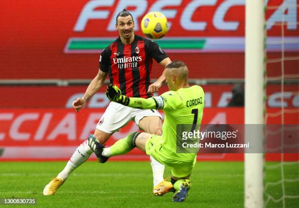 Zlatan Ibrahimovic of AC Milan scores their side's first goal past Alex Cordaz of Crotone during the Serie A match between AC Milan and FC Crotone at...