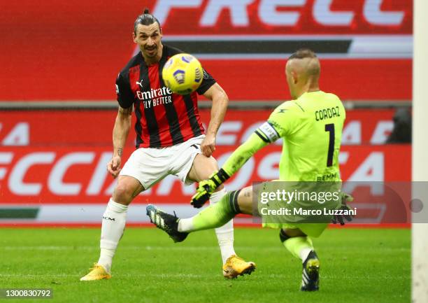 Zlatan Ibrahimovic of AC Milan scores their side's first goal past Alex Cordaz of Crotone during the Serie A match between AC Milan and FC Crotone at...