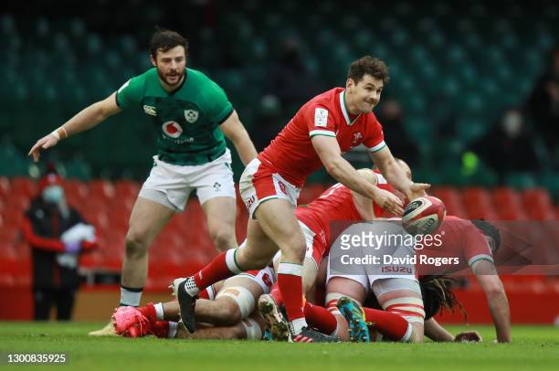 Tomos Williams of Wales passes out from the ruck during the Guinness Six Nations match between Wales and Ireland at the Principality Stadium on...
