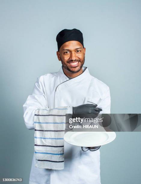 happy male chef with empty plate - empty plate isolated stock pictures, royalty-free photos & images
