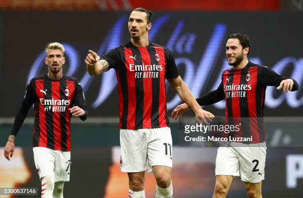Zlatan Ibrahimovic of AC Milan celebrates after scoring their side's second goal as he is congratulated by team mate Davide Calabria during the Serie...