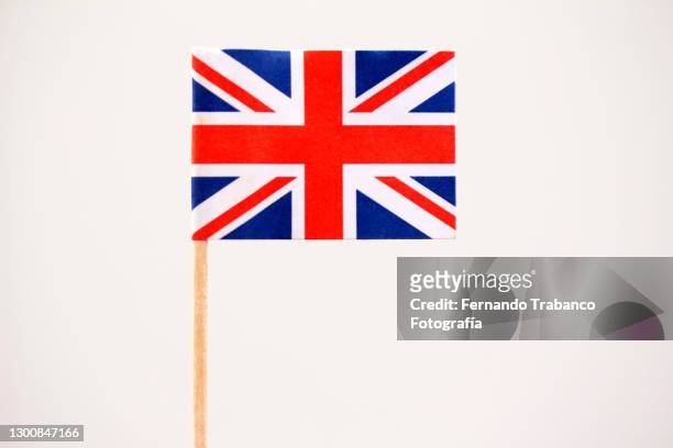 english flag on white background - union jack stock-fotos und bilder