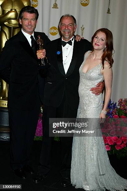 Jamie Selkirk, winner of Best Film Editing for "The Lord of the Rings: The Return of the King", with presenters Pierce Brosnan and Julianne Moore