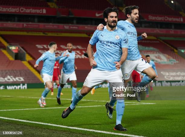Ilkay Gundogan of Manchester City celebrates with team mate Bernardo Silva after scoring their side's first goal during the Premier League match...
