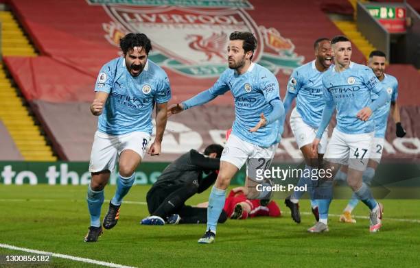 Ilkay Gundogan of Manchester City celebrates with team mate Bernardo Silva after scoring their side's first goal during the Premier League match...