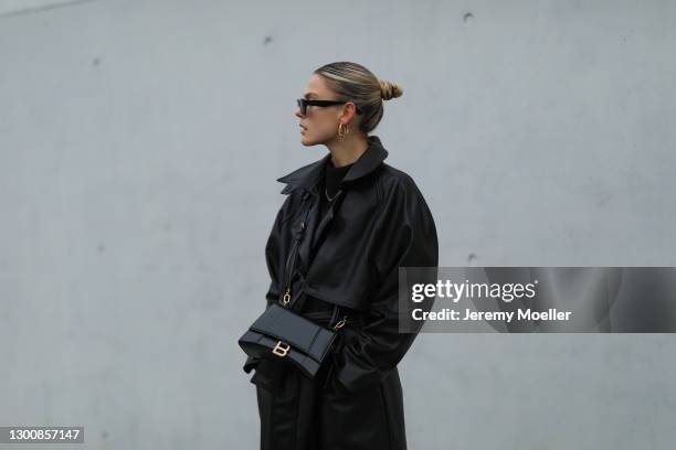 Alessa Winter wearing black shades, Zara black coat, Balenciaga leather bag on February 05, 2021 in Berlin, Germany.