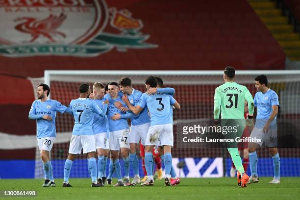 Phil Foden of Manchester City celebrates with team mates Bernardo Silva, Raheem Sterling, Oleksandr Zinchenko, John Stones and Ruben Dias after...