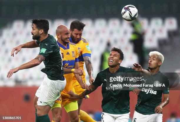 Carlos Gonzalez and Andre-Pierre Gignac of Tigres UANL compete for a header with Luan Garcia and Marcos Rocha of SE Palmeiras during the FIFA Club...