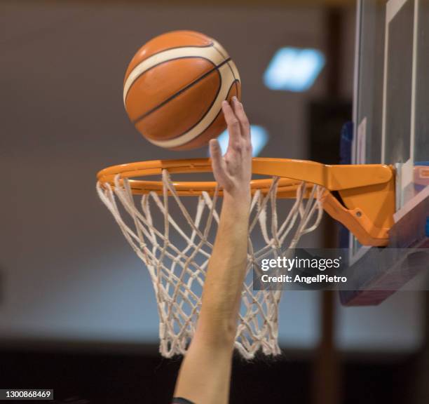 dunk in the basketball net - basketball hoop stock pictures, royalty-free photos & images
