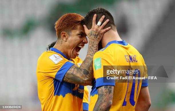 Andre-Pierre Gignac of Tigres UANL celebrates with teammate Carlos Salcedo after scoring their team's first goal during the FIFA Club World Cup Qatar...