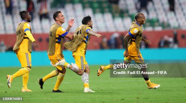 Jesus Duenas, Javier Aquino of Tigres UANL and teammates celebrate at full-time after the FIFA Club World Cup Qatar 2002 Semi-Final match between...