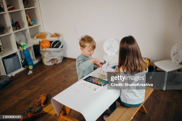 brother and sister painting - malfarbe stock pictures, royalty-free photos & images