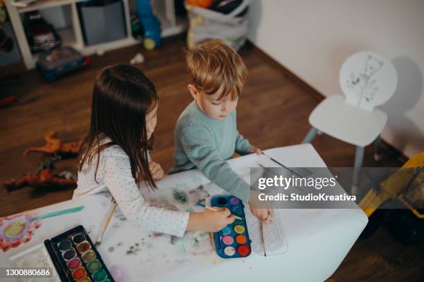 brother and sister painting - malfarbe stock pictures, royalty-free photos & images