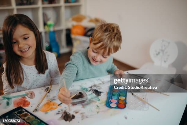 brother and sister painting - malfarbe stock pictures, royalty-free photos & images