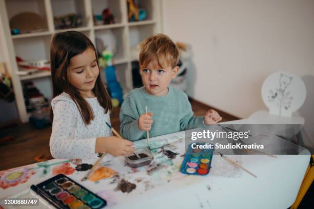 brother and sister painting - malfarbe stock pictures, royalty-free photos & images