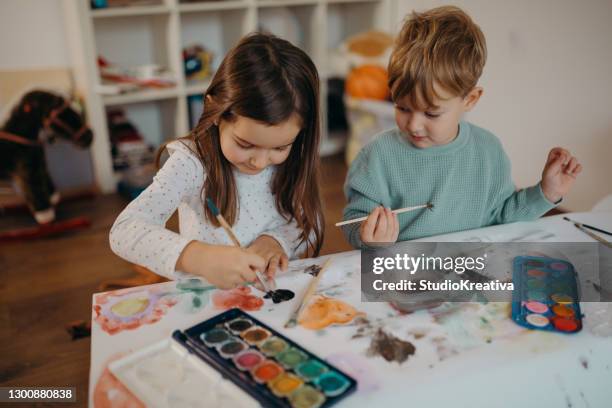 brother and sister painting - malfarbe stock pictures, royalty-free photos & images