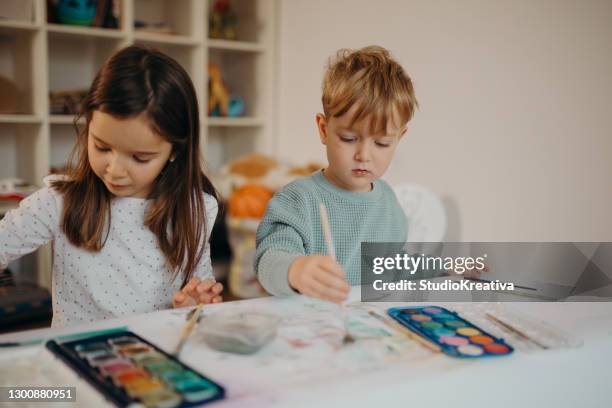 brother and sister painting - malfarbe stock pictures, royalty-free photos & images