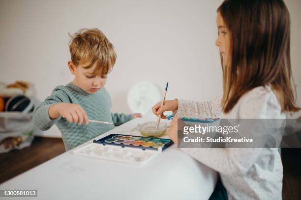 brother and sister painting - malfarbe stock pictures, royalty-free photos & images