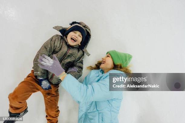 enjoying winter - family ice skate stock pictures, royalty-free photos & images