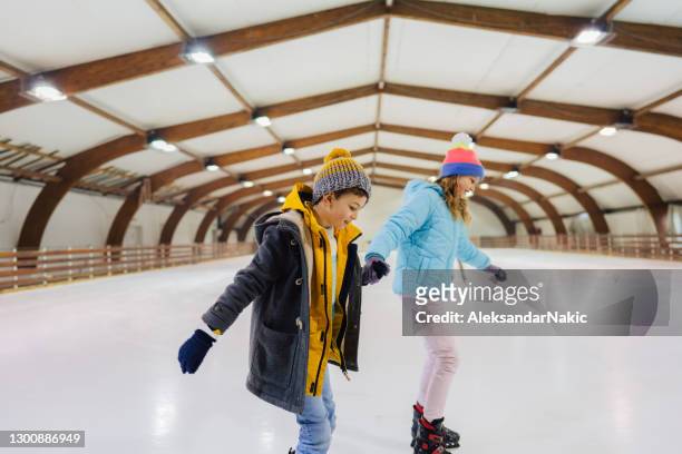 ice-skating with my sister - indoor ice rink stock pictures, royalty-free photos & images