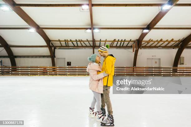 the warmest hug - indoor skating stock pictures, royalty-free photos & images