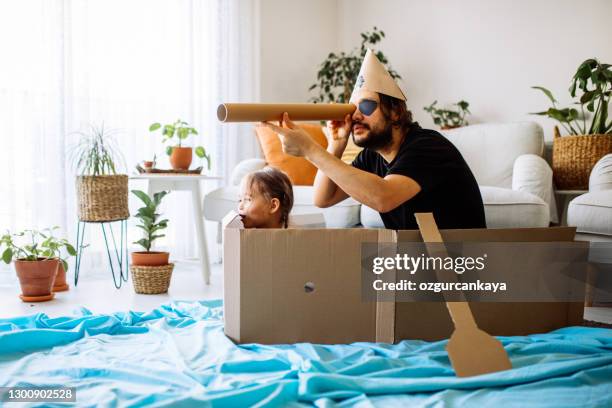 father playing exciting adventure game with daughter - binocular with man stock pictures, royalty-free photos & images