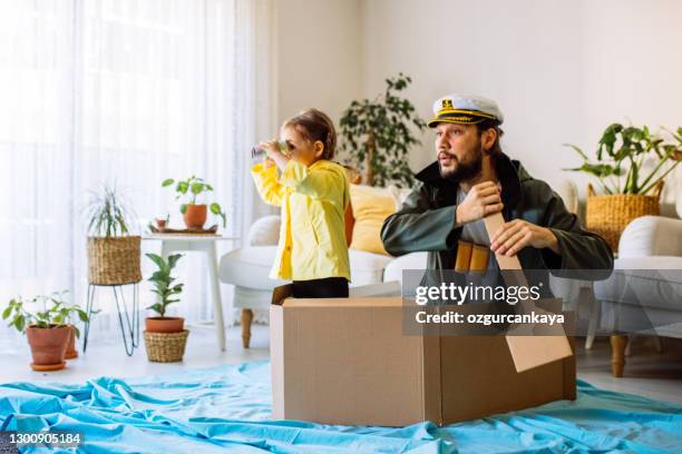 father playing exciting adventure game with daughter - creative fishing stock pictures, royalty-free photos & images