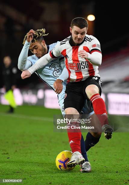 Reece James of Chelsea is tackled by John Fleck of Sheffield United during the Premier League match between Sheffield United and Chelsea at Bramall...