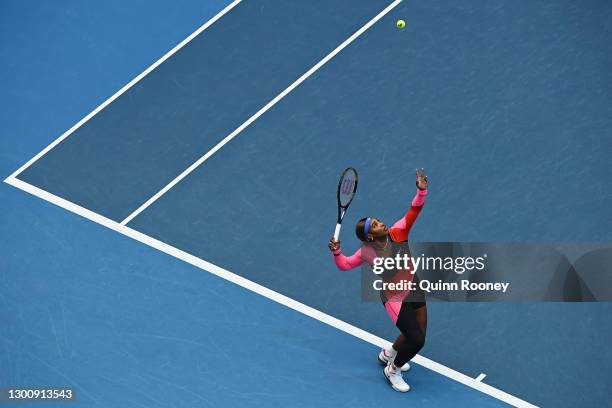 Serena Williams of The United States of America serves in her Women's Singles first round match against Laura Siegemund of Germany during day one of...