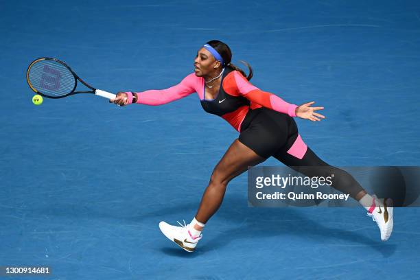 Serena Williams of The United States of America plays a forehand in her Women's Singles first round match against Laura Siegemund of Germany during...