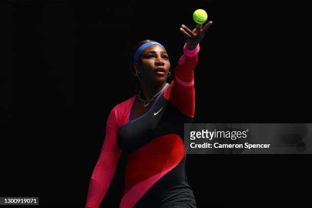 Serena Williams of The United States of America serves in her Women's Singles first round match against Laura Siegemund of Germany during day one of...
