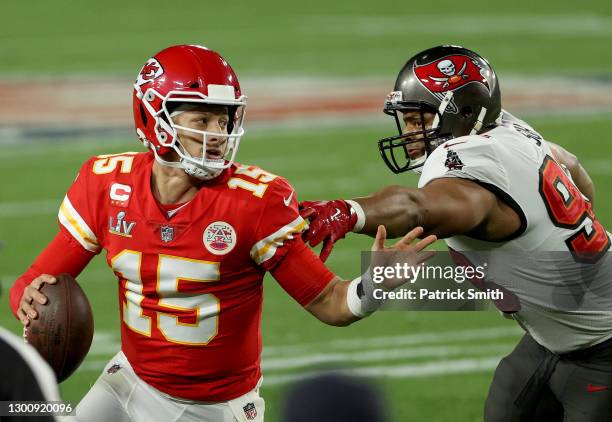 Patrick Mahomes of the Kansas City Chiefs is chased by Ndamukong Suh of the Tampa Bay Buccaneers during the fourth quarter in Super Bowl LV at...