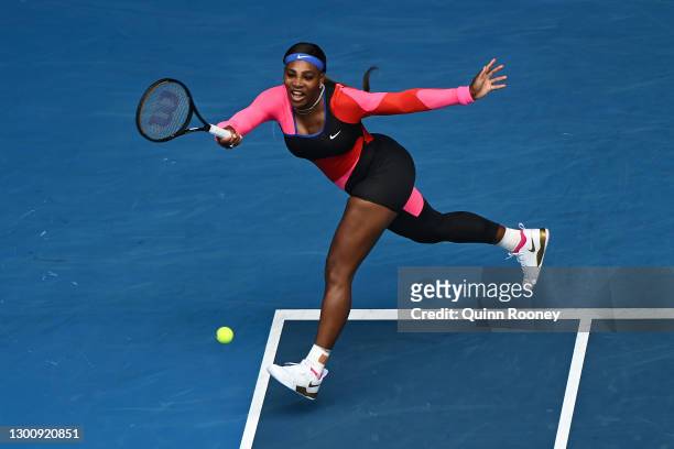 Serena Williams of The United States of America plays a forehand in her Women's Singles first round match against Laura Siegemund of Germany during...