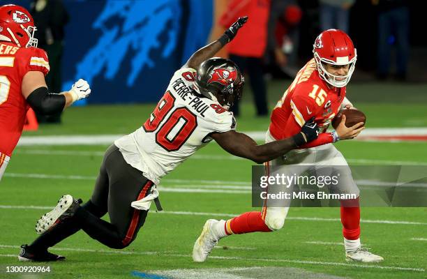 Jason Pierre-Paul of the Tampa Bay Buccaneers attempts to tackle Patrick Mahomes of the Kansas City Chiefs in the fourth quarter during Super Bowl LV...