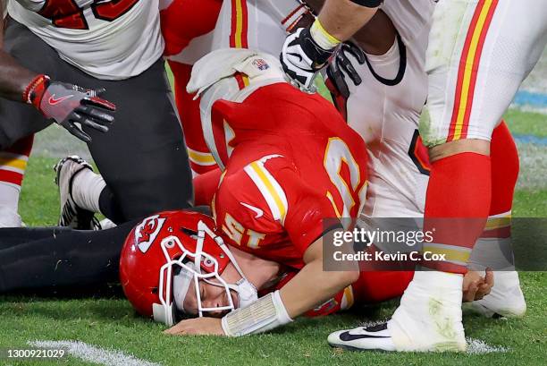 Patrick Mahomes of the Kansas City Chiefs is tackled by Devin White and Jason Pierre-Paul of the Tampa Bay Buccaneers in the fourth quarter in Super...
