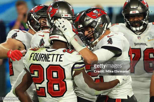 Tom Brady of the Tampa Bay Buccaneers reacts with teammates late in the fourth quarter against the Kansas City Chiefs in Super Bowl LV at Raymond...