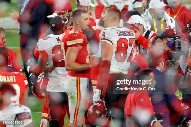 Travis Kelce of the Kansas City Chiefs and Rob Gronkowski of the Tampa Bay Buccaneers speak after Super Bowl LV at Raymond James Stadium on February...