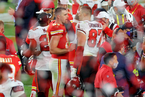 Travis Kelce of the Kansas City Chiefs and Rob Gronkowski of the Tampa Bay Buccaneers speak after Super Bowl LV at Raymond James Stadium on February...